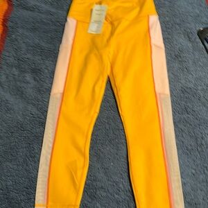 Fabletics powerhold on-the-go high waisted capri pants.  medium  orange pink